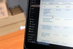 WebFlow vs WordPress 101- A Detailed Comparison for Digital Creators 14 a laptop computer sitting on top of a wooden desk