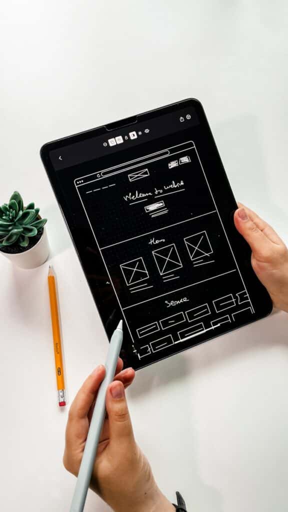 The Vital Art of User Interface Design | A Deep-Dive for Small Business Owners 27 person holding black ipad with green plant