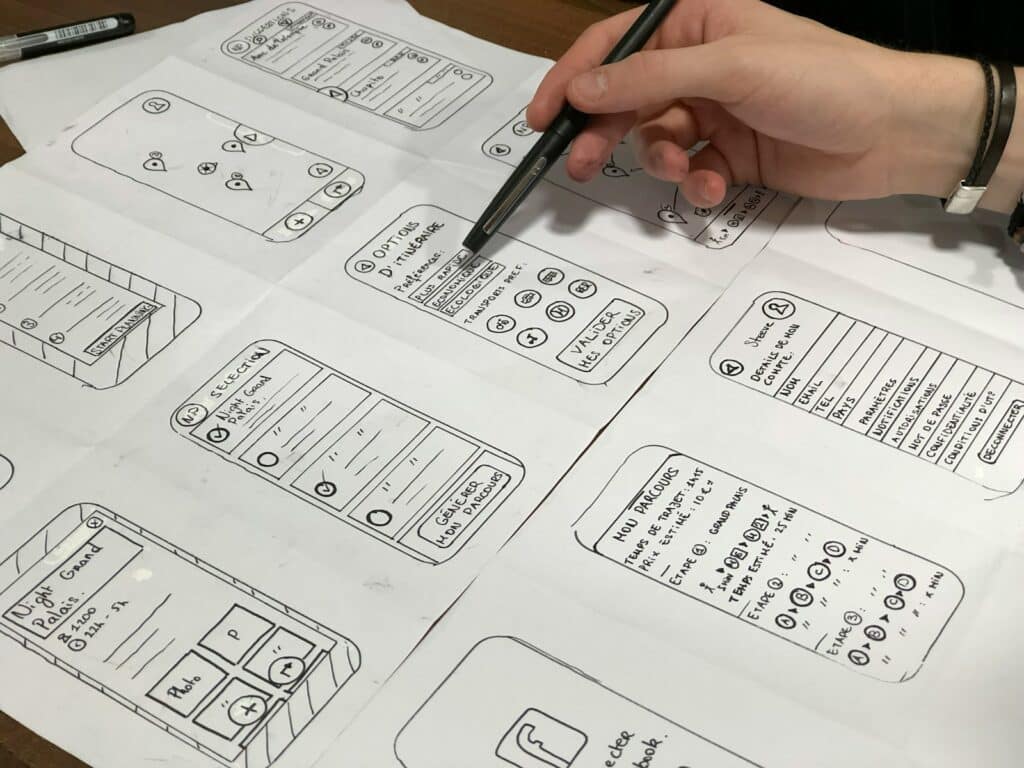 The Vital Art of User Interface Design | A Deep-Dive for Small Business Owners 25 person holding pen near paper