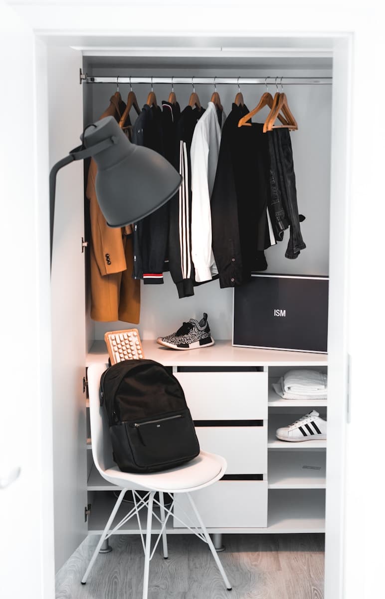 How To Start A Clothing Brand The Right Way 14 black backpack on white chair beside cabinet
