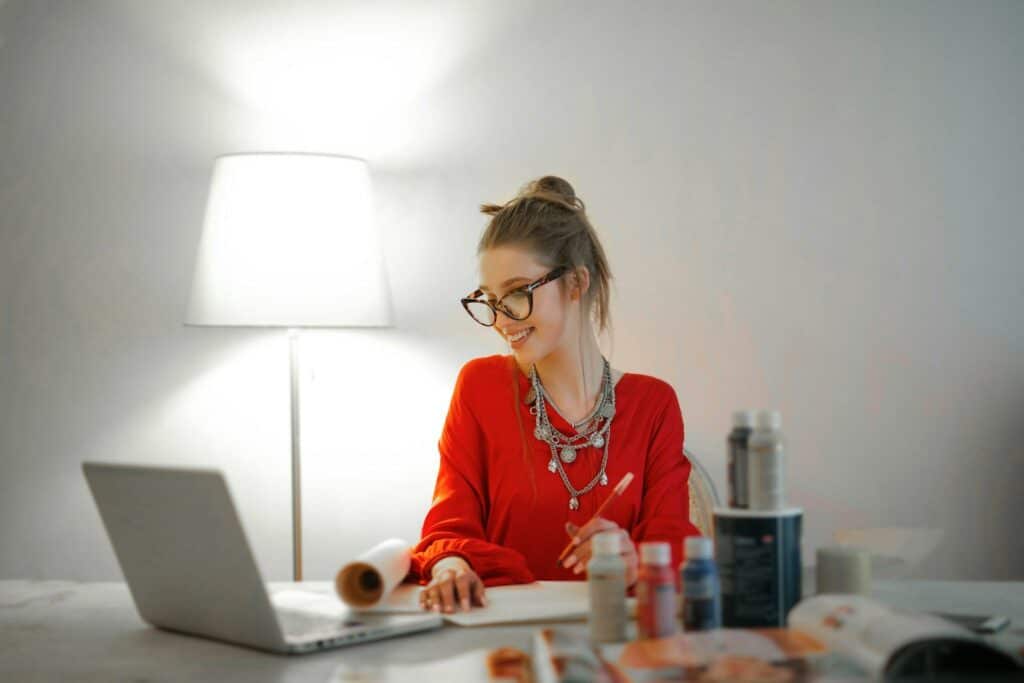 How To Start A Home Based Business 14 Woman in Red Long Sleeve Shirt Looking At Her LAptop