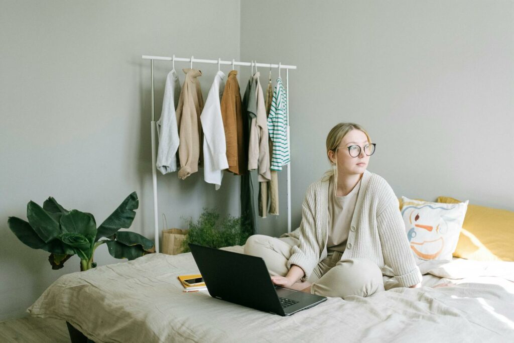 How To Start A Home Based Business 16 A Woman in Beige Sweater Sitting on the Bed