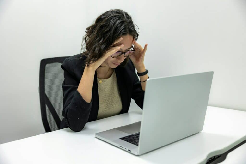Suicide Awareness Month 2024: Prioritizing Mental Health in the Workplace 10 a woman sitting in front of a laptop computer