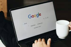 Search Engine Marketing Services That Work: Elevating Small Business Visibility 12 A person sitting in front of a laptop computer
