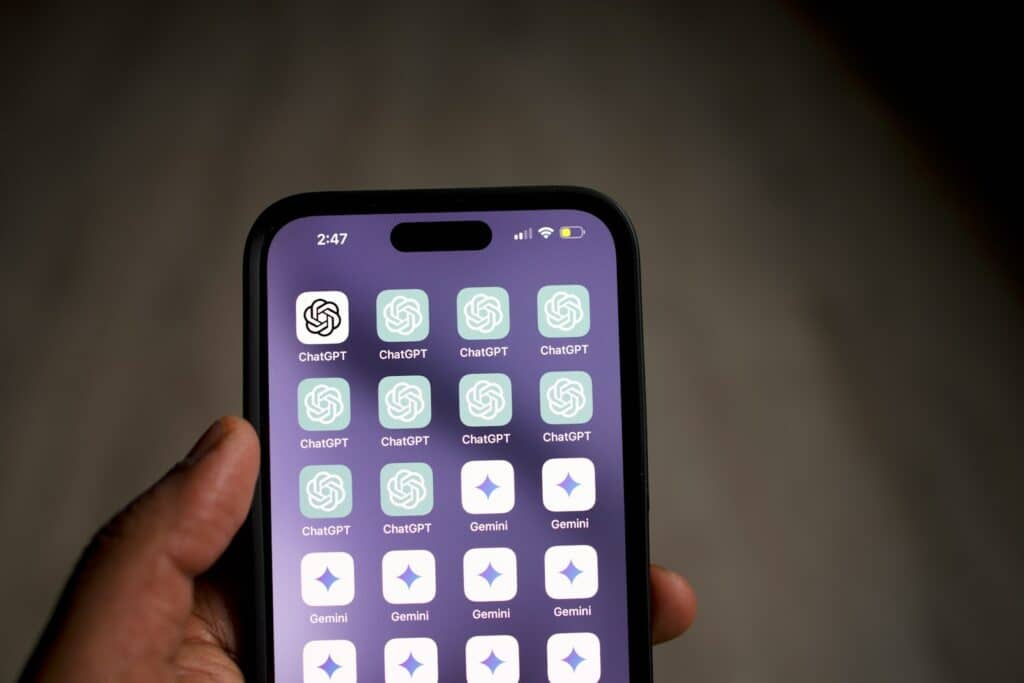 a person holding a cell phone in their hand