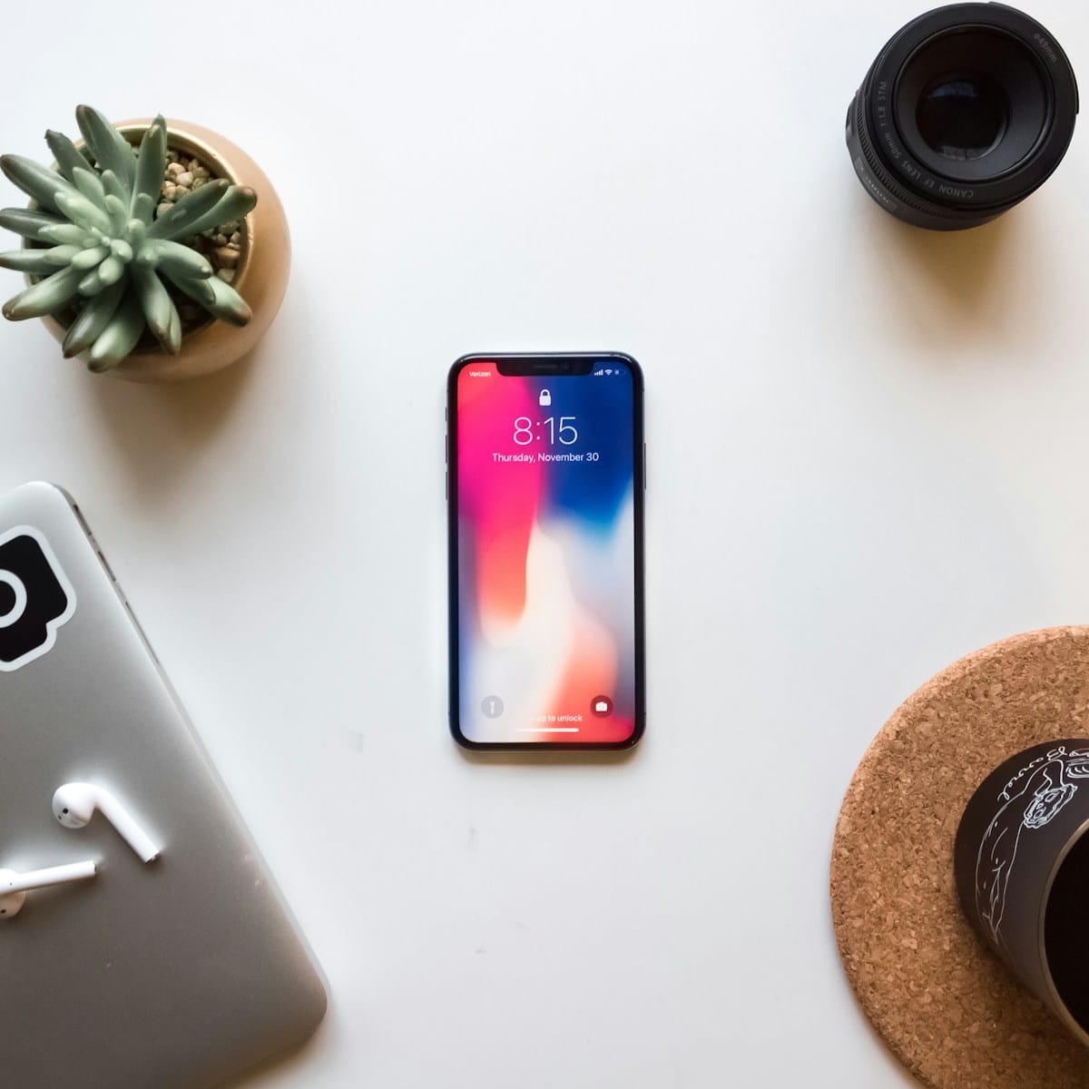 Photo by Ben Kolde space gray iPhone X near green succulent mobile website design