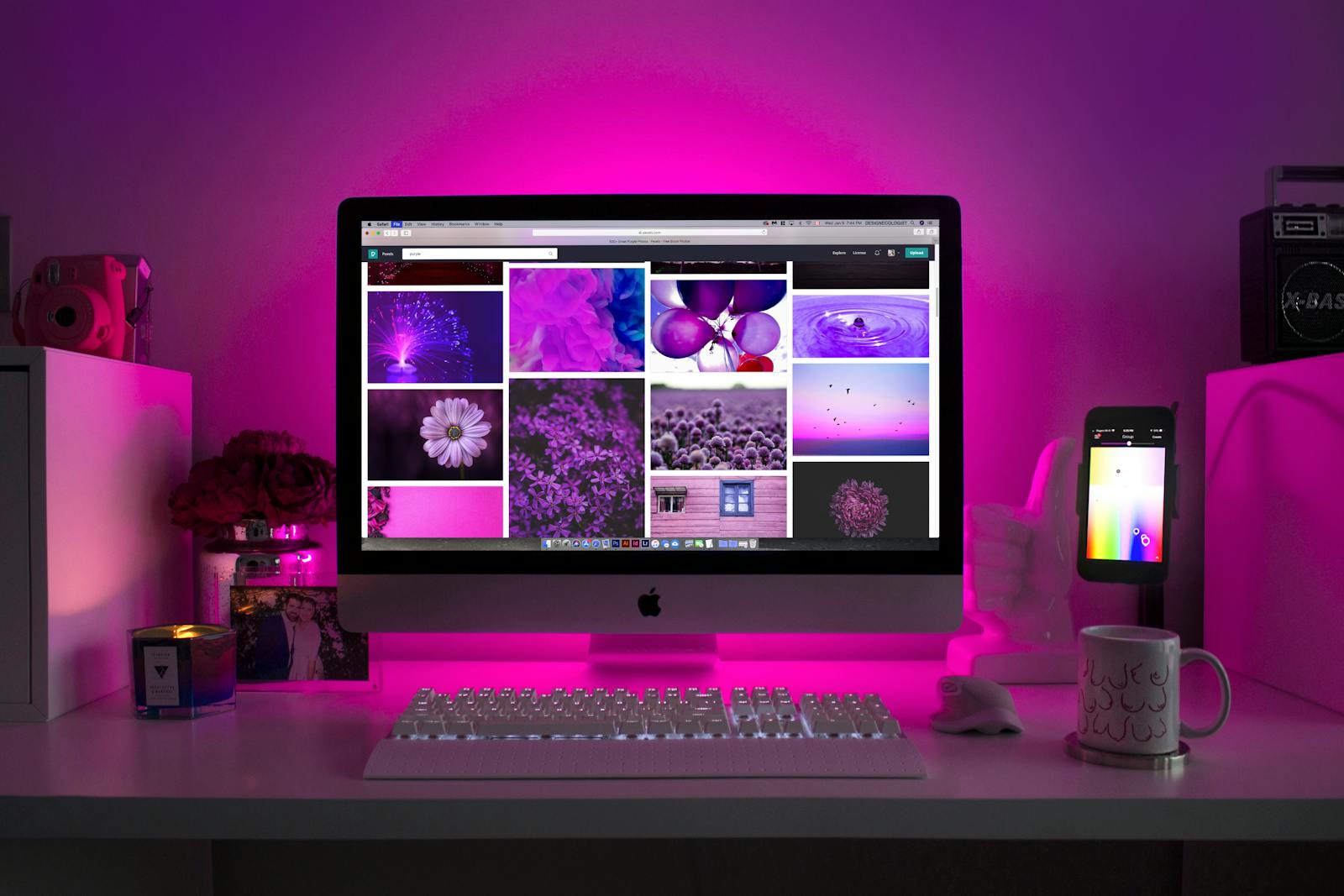 Photo by Designecologist Modern desk setup with neon lighting and a desktop computer displaying colorful images. wix website builder
