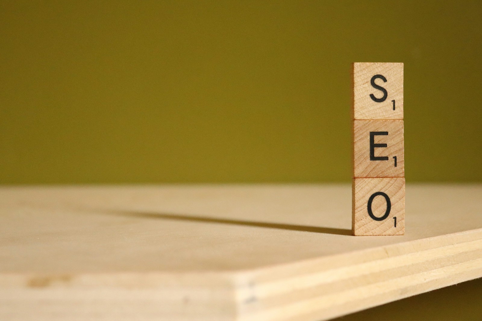 Photo by NisonCo PR and SEO a scrabbled wooden block with the word stem on it outsource seo services