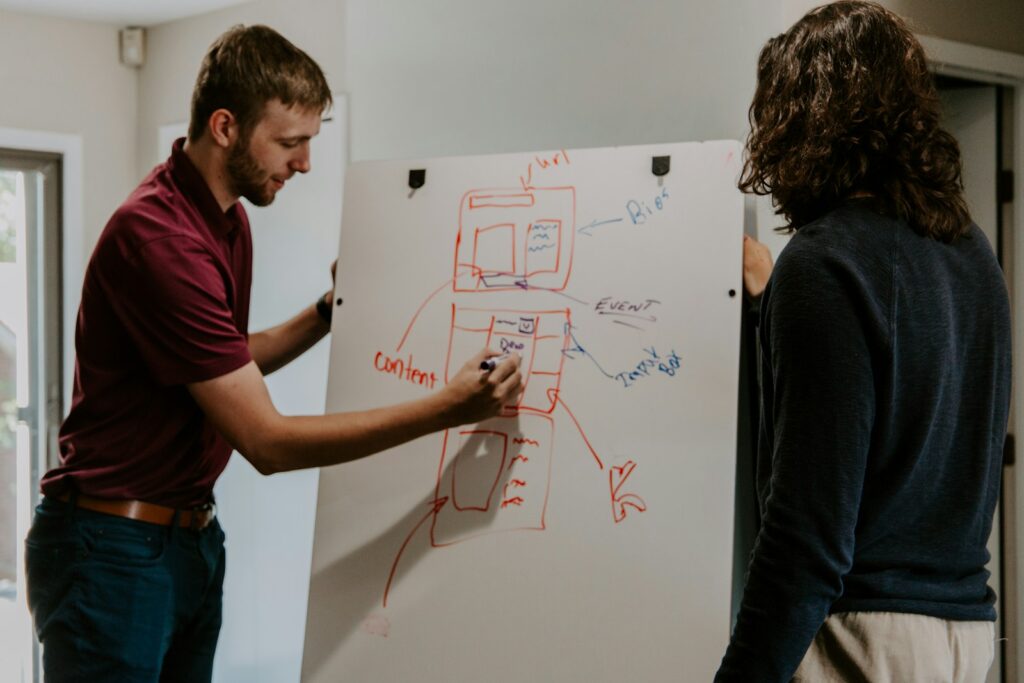 Mastering Your SEO Content Strategy: A Practical Guide for Success 8 man drawing on dry-erase board