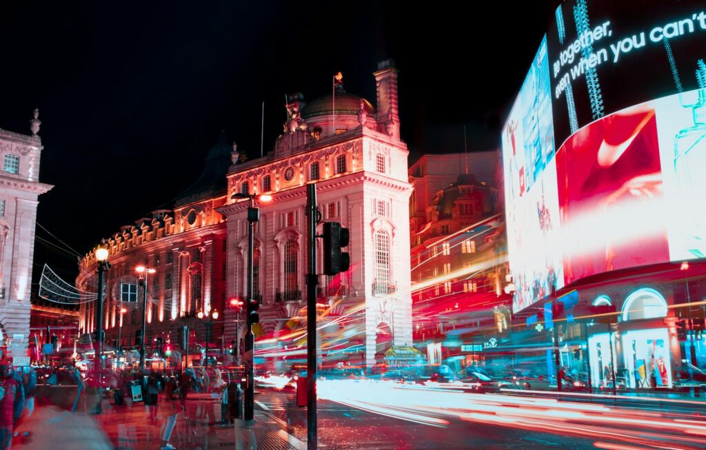 Unlocking the Potential of Paid Media Services with Priceless Consulting 26 Long exposure captures vibrant city lights and nightlife at Piccadilly Circus, London.