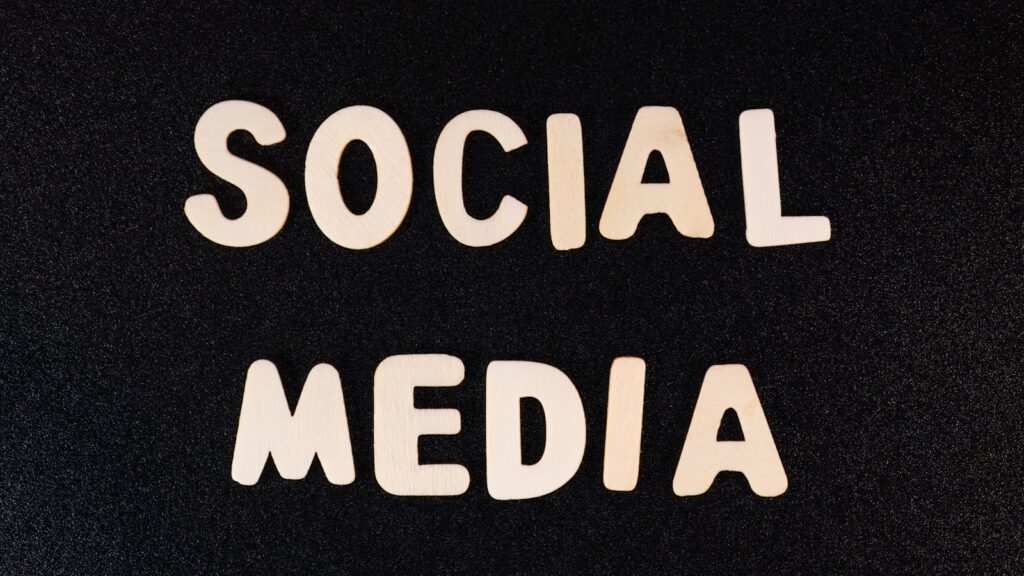 the word social media written in white type on a black background